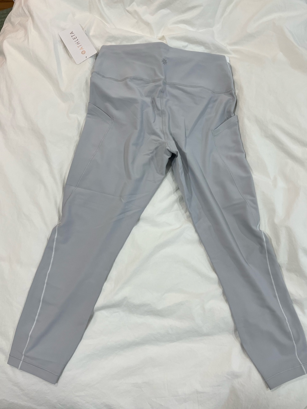 Athleta Interval Stash High Rise Tipped 7/8 Leggings.